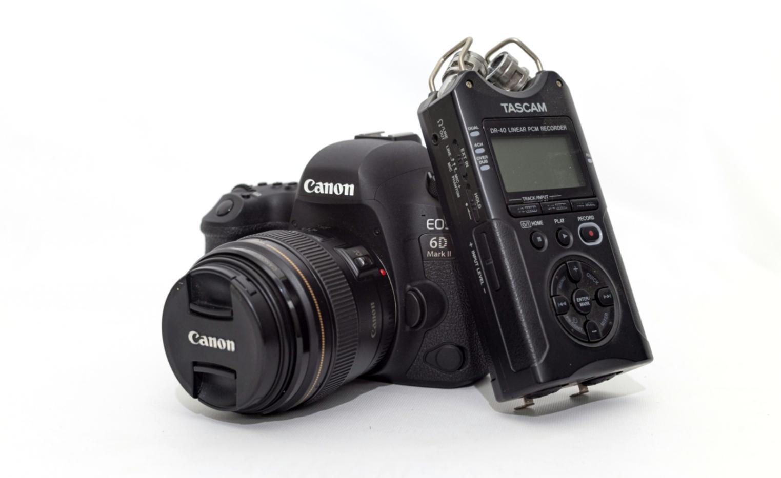 Professional video editing workspace showing multiple monitors and editing timeline